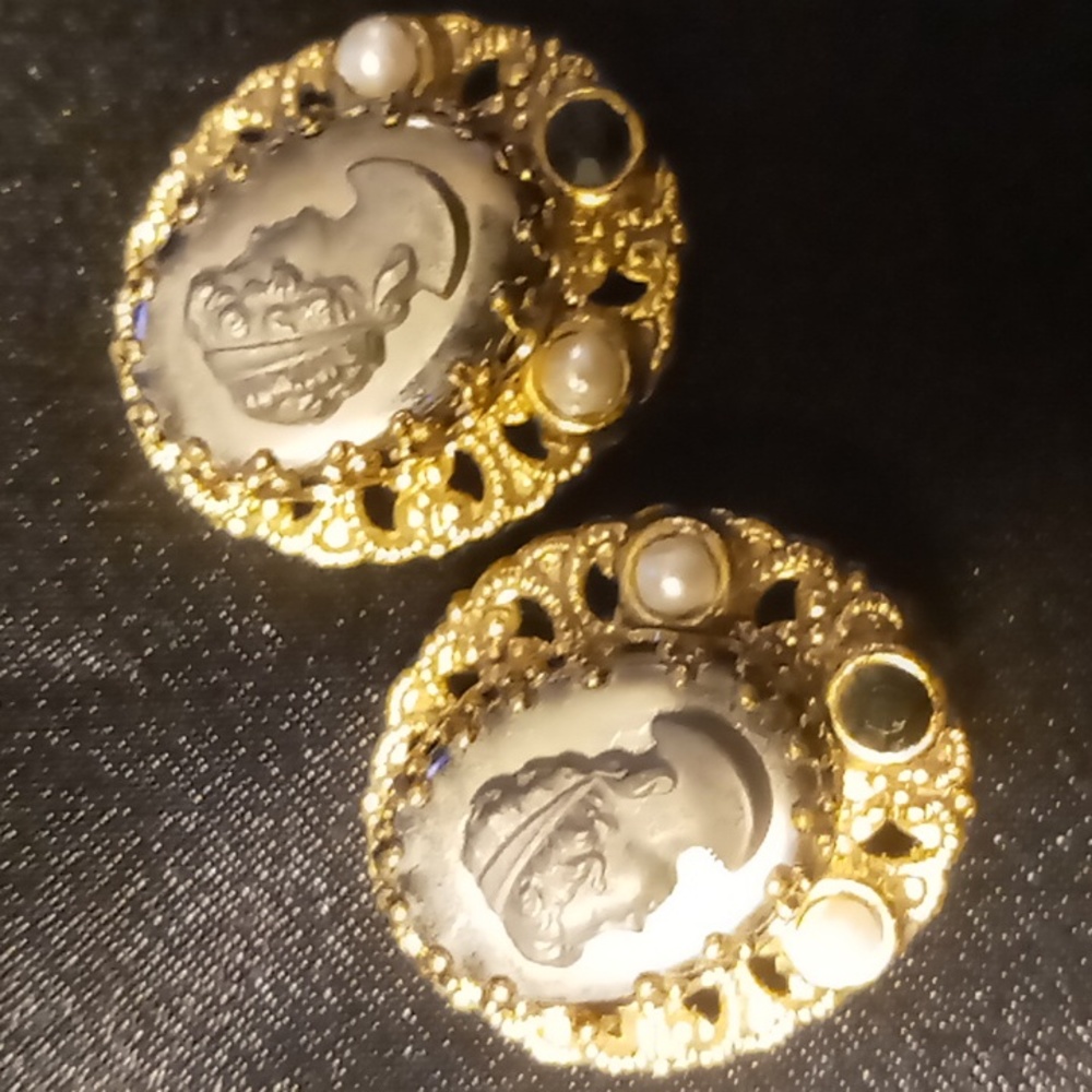 Vintage black Cameo clip earrings with blue stones with pearl accents.